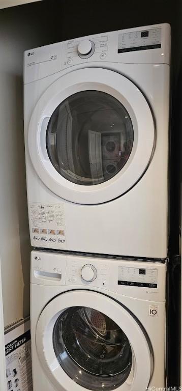 laundry room with laundry area and stacked washer / drying machine