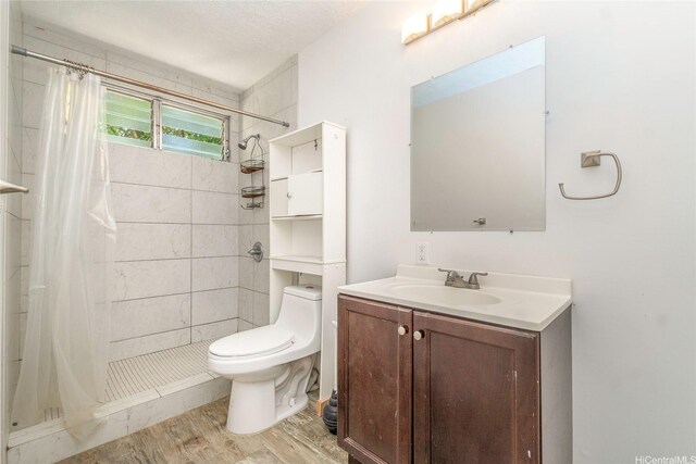 47-325 Ahuimanu Rd, Kaneohe, HI 96744 - bathroom featuring toilet, a stall shower, wood finished floors, and vanity