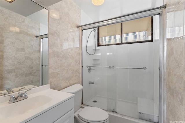 99-015 Kalaloa St Unit 803, Aiea, HI 96701 - full bath featuring a shower with door, tile walls, toilet, and vanity