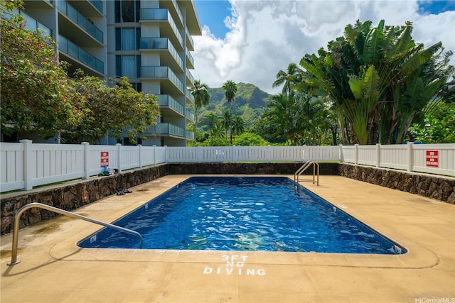 53-549 Kamehameha Hwy Unit 514, Hauula, HI 96717 - community pool with a fenced backyard, a mountain view, and a patio