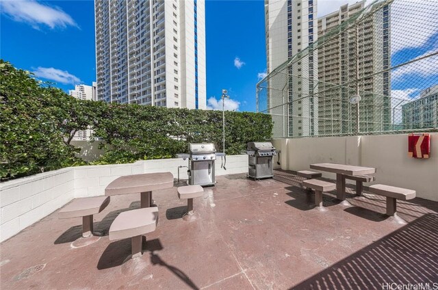 469 Ena Rd Unit 505, Honolulu, HI 96815 - view of patio with a view of city and a grill
