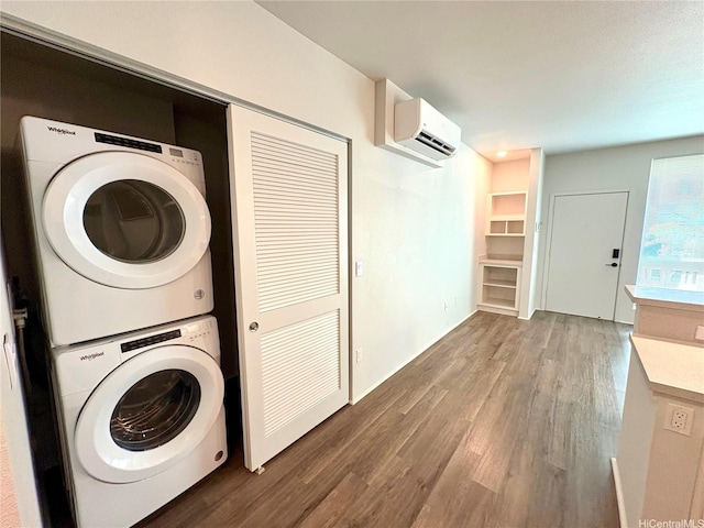 91-3525 Kauluakoko St Unit 2213, Ewa Beach, HI 96706 - washroom featuring estacked washer and dryer, a wall mounted AC, and wood finished floors