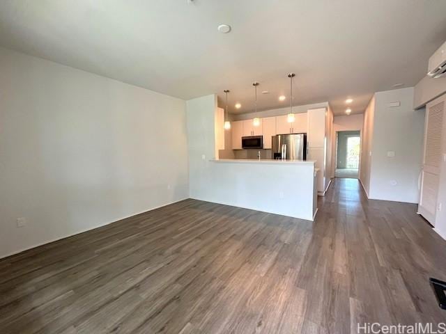 91-3525 Kauluakoko St Unit 2213, Ewa Beach, HI 96706 - unfurnished living room with dark wood-type flooring and recessed lighting