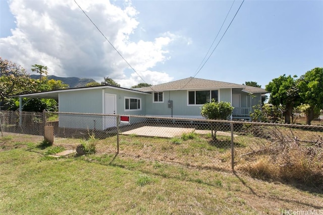 view of front of home with fence private yard and a front lawn