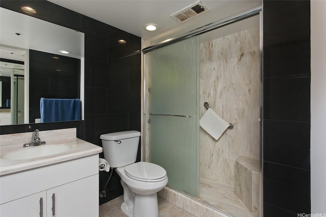 60 N Beretania St Unit 3405, Honolulu, HI 96817 - full bathroom featuring vanity, toilet, a shower stall, and tile walls