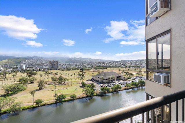 balcony with a water and mountain view and cooling unit