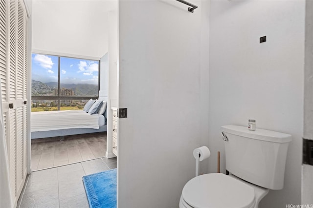 bathroom featuring tile patterned flooring and toilet