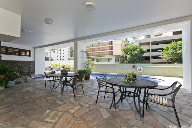 view of patio / terrace with outdoor dining area and a fenced in pool