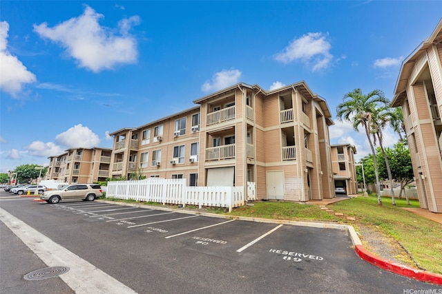 91-1213 Kaneana St Unit 12D, Ewa Beach, HI 96706 - view of apartment building / complex with uncovered parking