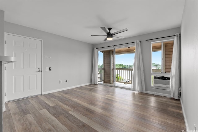 91-1213 Kaneana St Unit 12D, Ewa Beach, HI 96706 - spare room featuring cooling unit, wood finished floors, and a ceiling fan