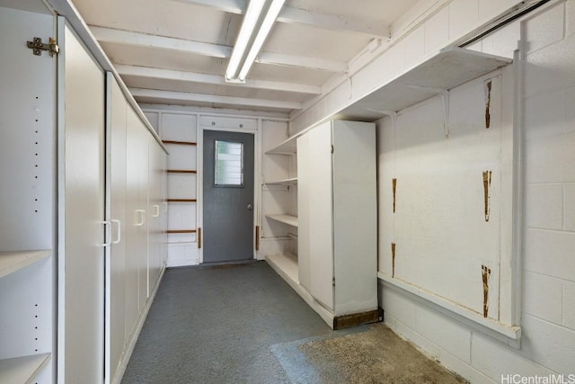 interior space featuring concrete block wall