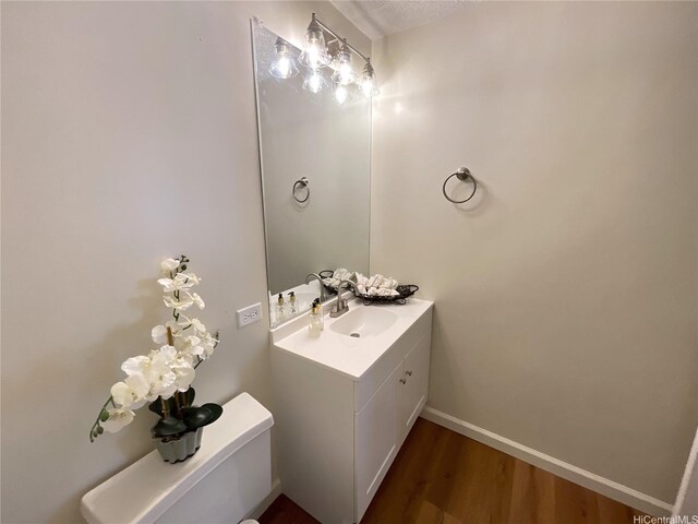 2452 Tusitala St Unit 703, Honolulu, HI 96815 - half bath with vanity and wood finished floors