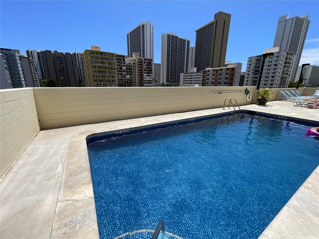 2452 Tusitala St Unit 703, Honolulu, HI 96815 - community pool with a view of skyline