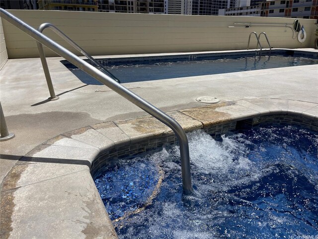 2452 Tusitala St Unit 703, Honolulu, HI 96815 - community pool featuring a community hot tub