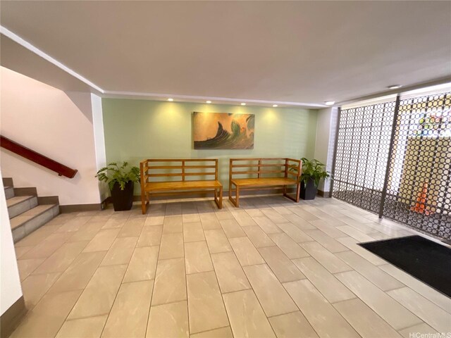 2452 Tusitala St Unit 703, Honolulu, HI 96815 - building lobby with stairs, recessed lighting, and a wall of windows
