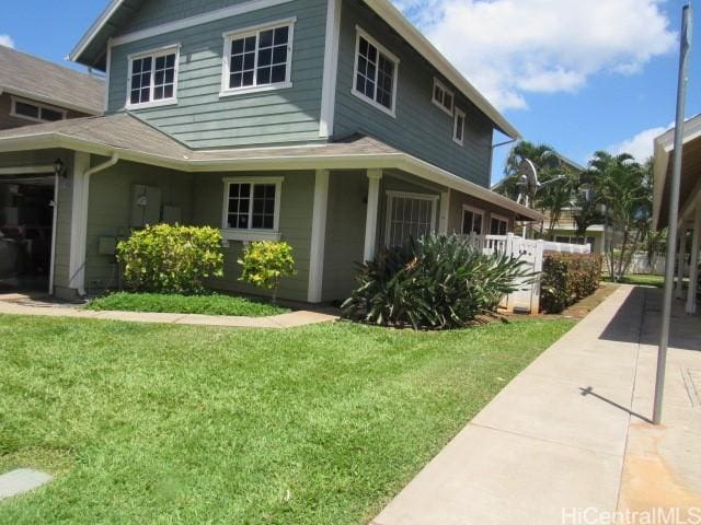 view of home's exterior featuring a lawn