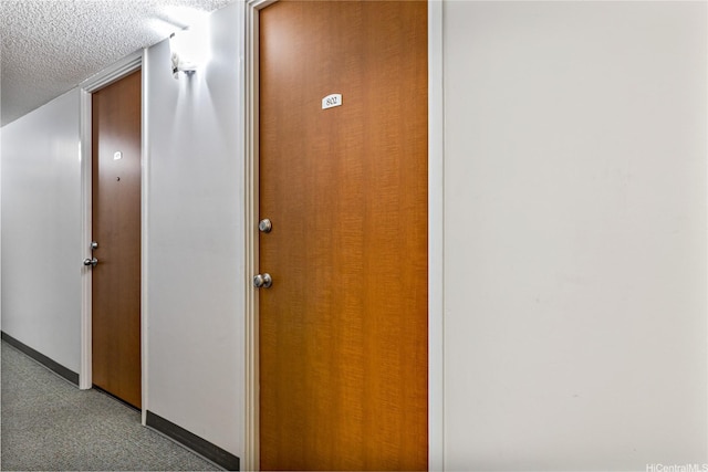 2572 Lemon Rd Unit 802, Honolulu, HI 96815 - hallway featuring a textured ceiling and baseboards
