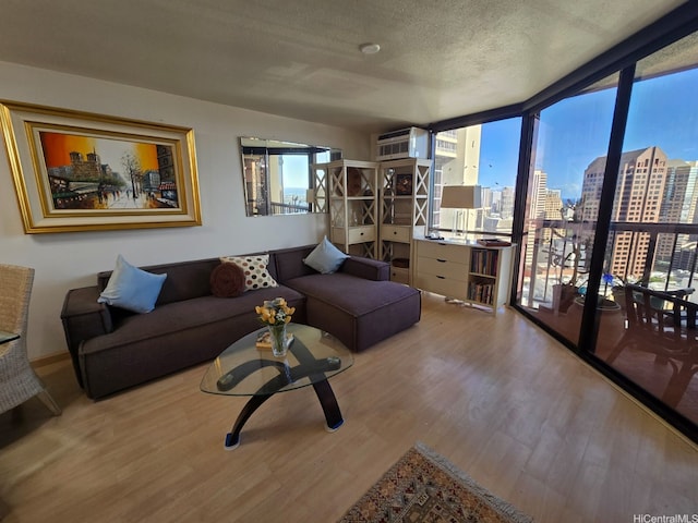 60 N Beretania St Unit 3209, Honolulu, HI 96817 - living area with wood finished floors, a city view, and a textured ceiling
