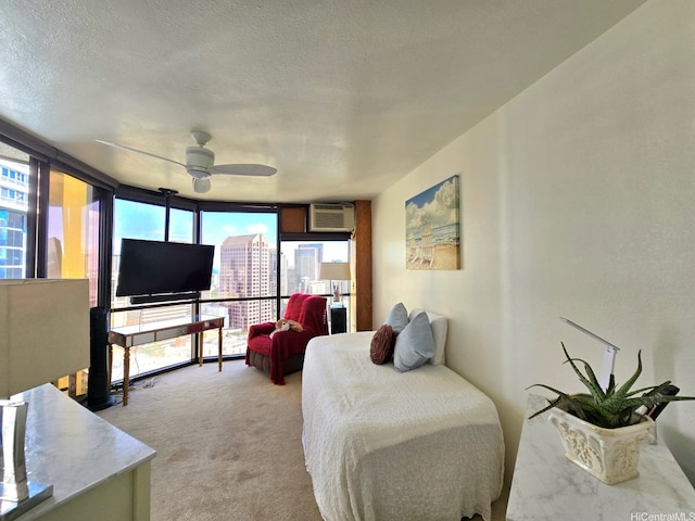 60 N Beretania St Unit 3209, Honolulu, HI 96817 - living area featuring a ceiling fan, light carpet, plenty of natural light, expansive windows, and a textured ceiling