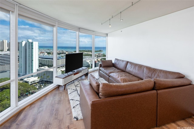 1288 Kapiolani Blvd Unit I2903, Honolulu, HI 96814 - living area with wood finished floors, rail lighting, and expansive windows