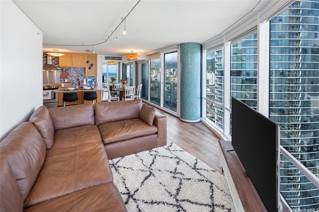 1288 Kapiolani Blvd Unit I2903, Honolulu, HI 96814 - living room with visible vents, rail lighting, and wood finished floors