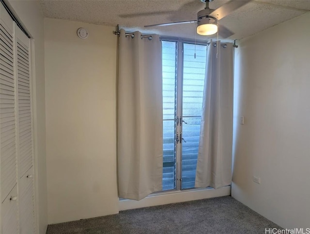 2845 Waialae Ave Unit 116, Honolulu, HI 96826 - interior space with a ceiling fan, a closet, carpet flooring, and a textured ceiling