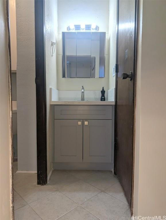 2845 Waialae Ave Unit 116, Honolulu, HI 96826 - bathroom featuring tile patterned flooring and vanity