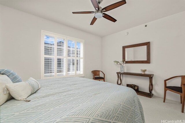 carpeted bedroom featuring a ceiling fan