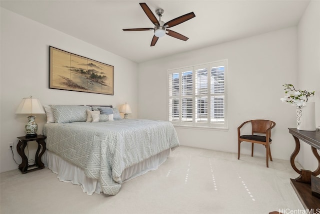 bedroom featuring a ceiling fan and carpet
