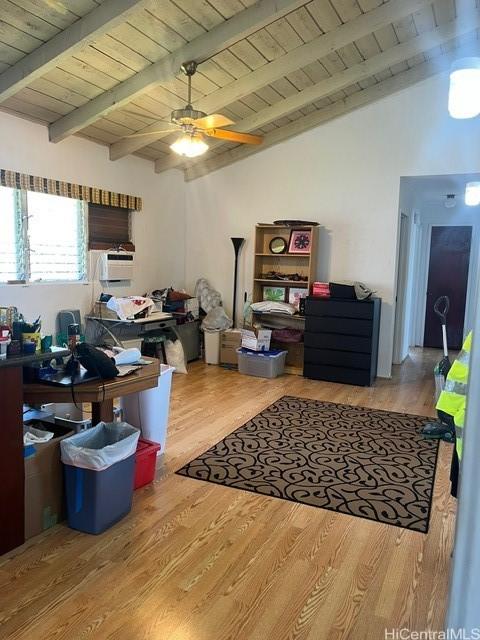interior space featuring ceiling fan, wood ceiling, vaulted ceiling with beams, and wood finished floors