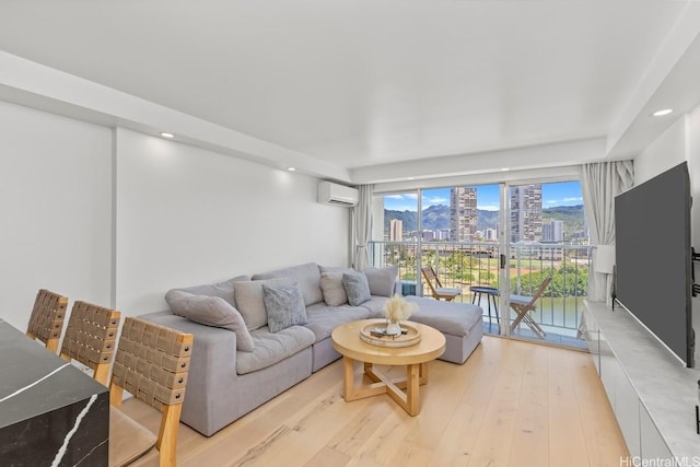 2211 Ala Wai Blvd Unit 906, Honolulu, HI 96815 - living area with a wall mounted AC, light wood-type flooring, and recessed lighting