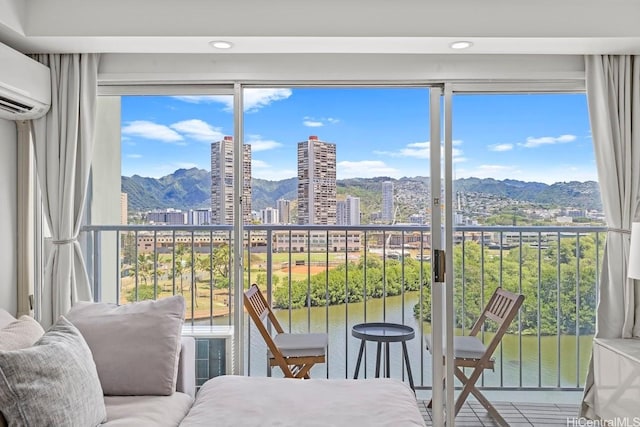 2211 Ala Wai Blvd Unit 906, Honolulu, HI 96815 - balcony with a water and mountain view and a wall mounted AC