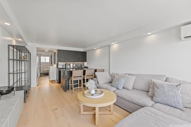 2211 Ala Wai Blvd Unit 906, Honolulu, HI 96815 - living area with light wood-style flooring, a wall unit AC, and recessed lighting