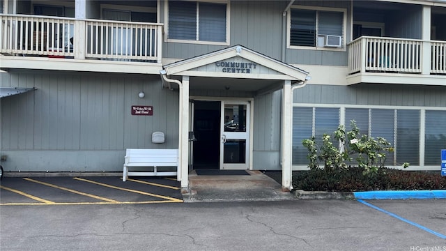 95-1050 Makaikai St Unit 13K, Mililani, HI 96789 - entrance to property with a balcony, uncovered parking, and cooling unit