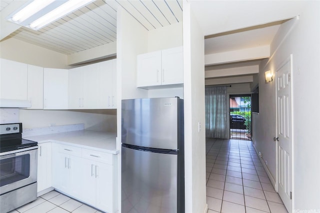 4202 Keanu St Unit 4, Honolulu, HI 96816 - kitchen featuring stainless steel appliances, light countertops, under cabinet range hood, light tile patterned floors, and white cabinets