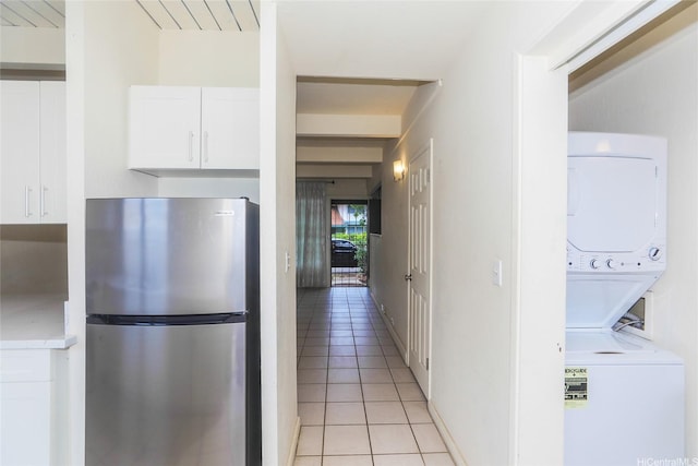 4202 Keanu St Unit 4, Honolulu, HI 96816 - corridor featuring stacked washer / dryer and light tile patterned flooring
