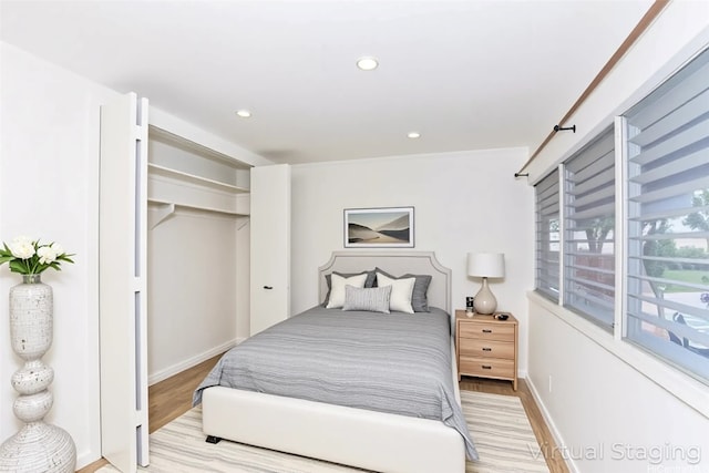 4202 Keanu St Unit 4, Honolulu, HI 96816 - bedroom with light wood-style floors, baseboards, recessed lighting, and a closet