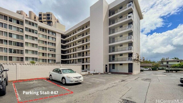 5122 Likini St Unit 616, Honolulu, HI 96818 - view of building exterior featuring uncovered parking