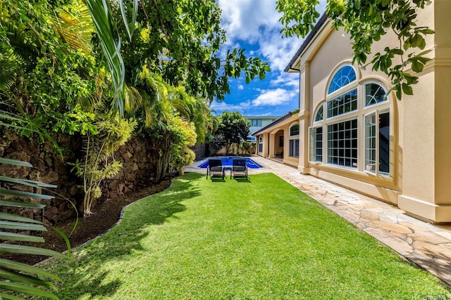 view of yard with a fenced backyard