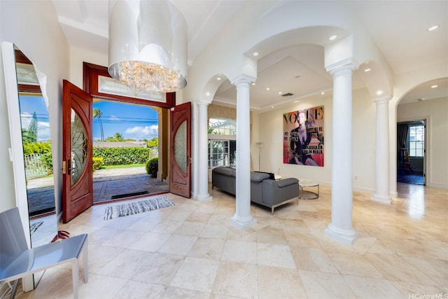 foyer featuring ornate columns and recessed lighting