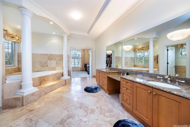 full bathroom with ornate columns, a garden tub, and a healthy amount of sunlight