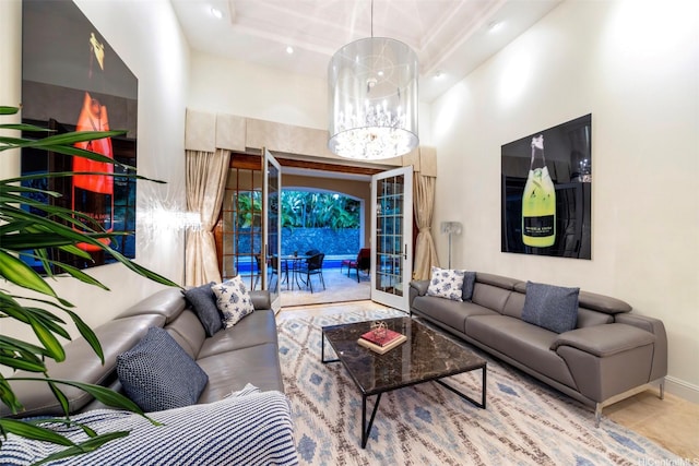 living room featuring a high ceiling, baseboards, and recessed lighting