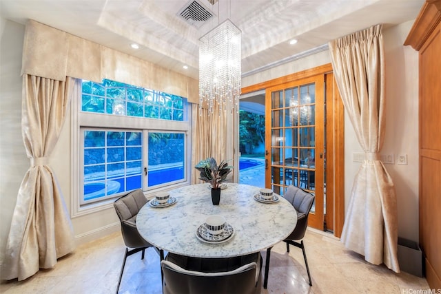 dining area with visible vents, a raised ceiling, a chandelier, recessed lighting, and light tile patterned flooring