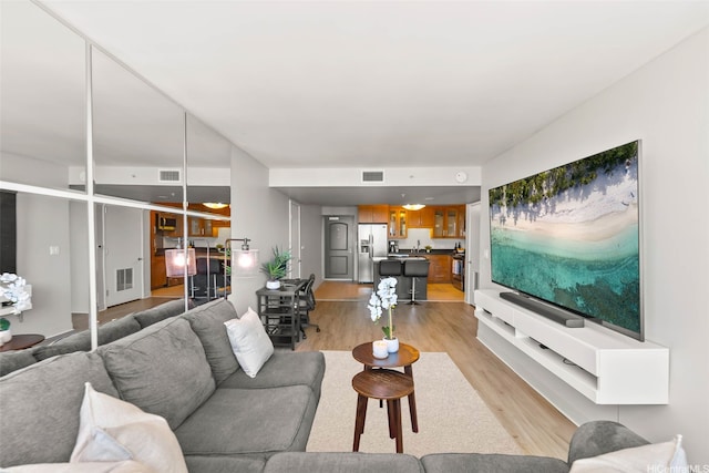 1009 Kapiolani Blvd Unit 4006, Honolulu, HI 96814 - living area featuring light wood-style floors
