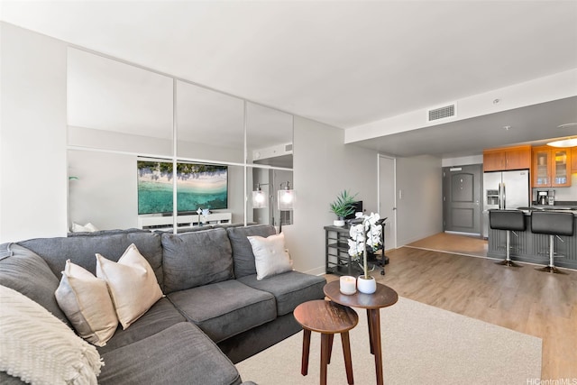 1009 Kapiolani Blvd Unit 4006, Honolulu, HI 96814 - living area featuring light wood-style floors and baseboards
