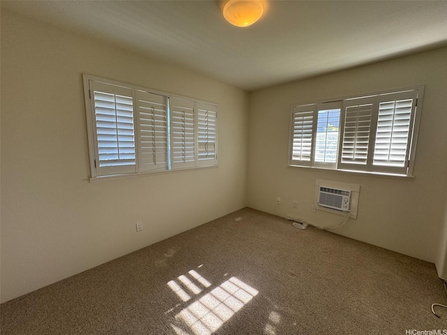 carpeted empty room with a wall mounted air conditioner