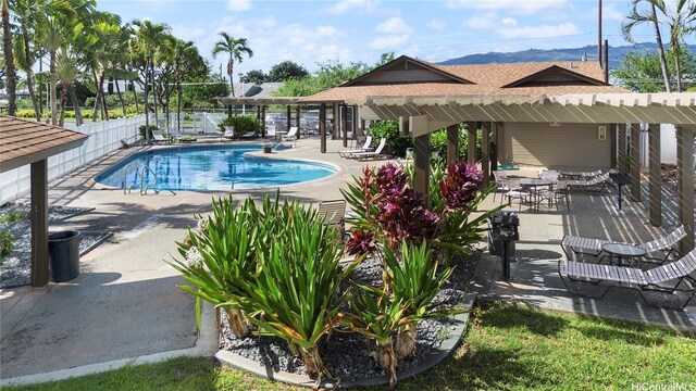 91-1060 Puamaeole St Unit 12B, Ewa Beach, HI 96706 - community pool with a patio area and a mountain view