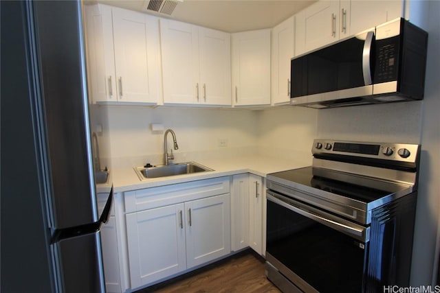225 Queen St Unit 8C, Honolulu, HI 96813 - kitchen with light countertops, appliances with stainless steel finishes, a sink, and visible vents