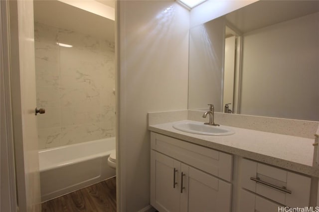 225 Queen St Unit 8C, Honolulu, HI 96813 - bathroom with  shower combination, vanity, toilet, and wood finished floors