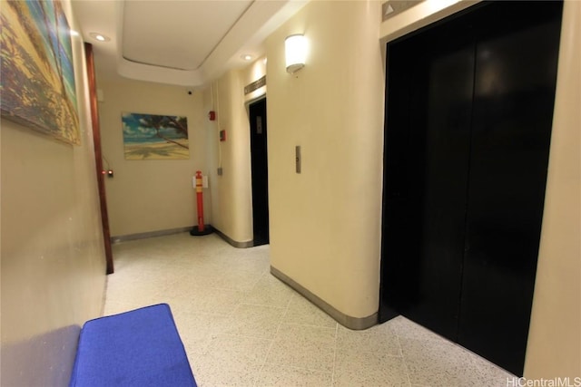 225 Queen St Unit 8C, Honolulu, HI 96813 - hallway with elevator, baseboards, and light floors